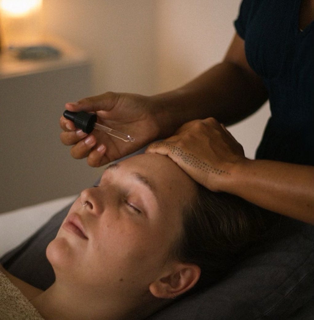 person applies oil to a face